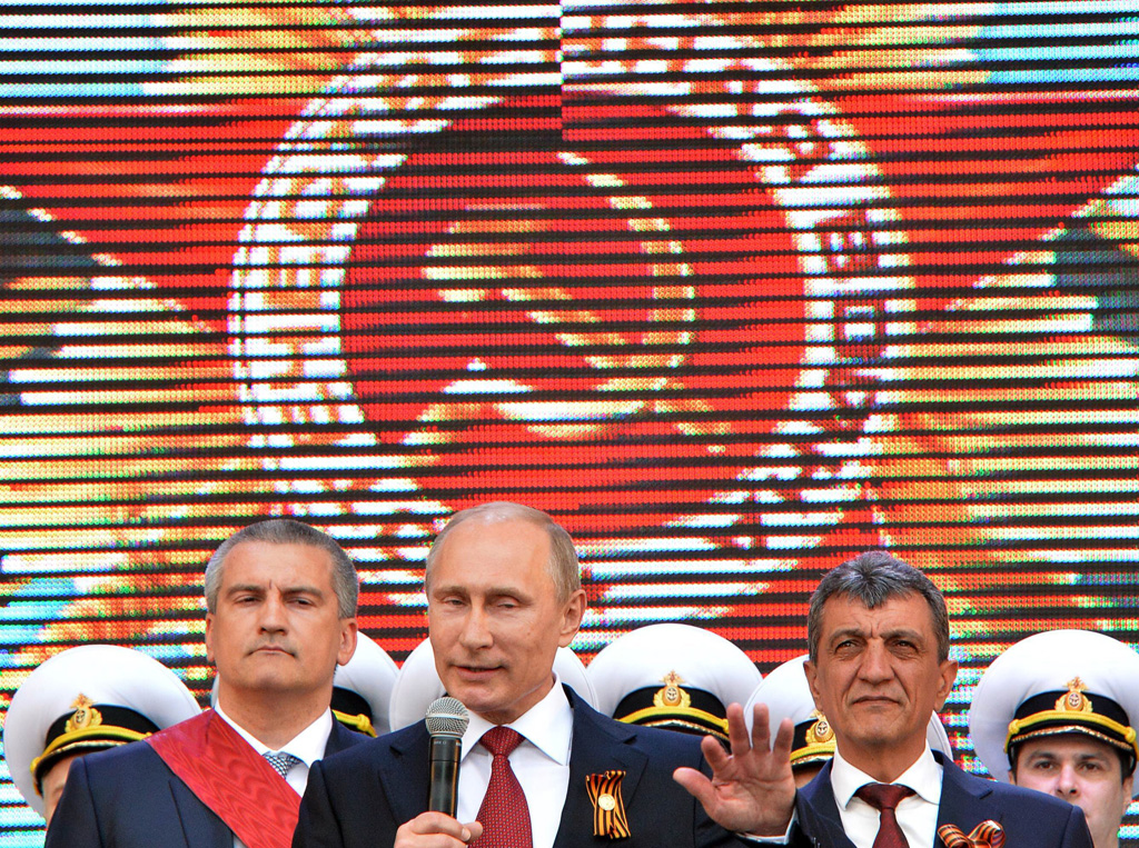 russian president vladimir putin speaks during his visit to the crimean port of sevastopol on may 9 2014 photo afp