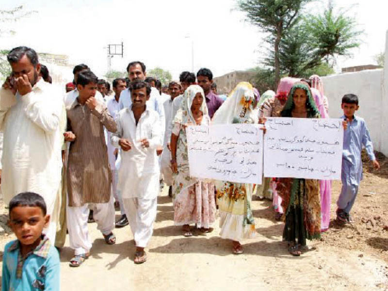 members of the swami community have been holding protests in chachro tharparkar since may 5 to reclaim the alleged encroachment on their graveyard and demand better governance in the area ninety year old satram das has been participating in the protests every day photo courtesy aware