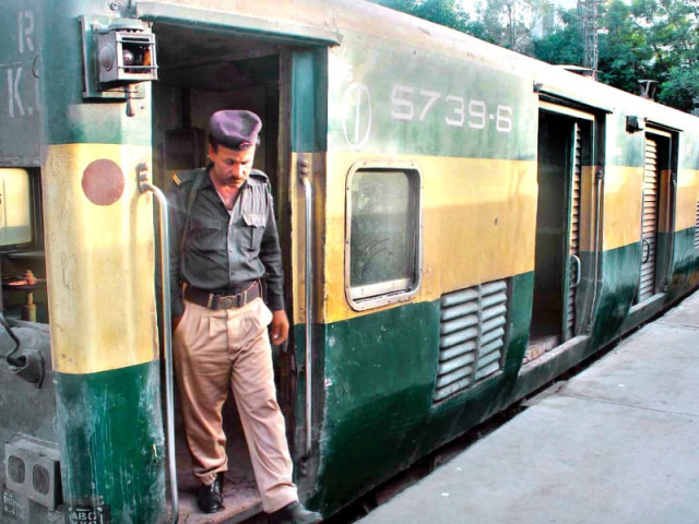 a policeman comes out of the karachi express compartment from which the prize bonds disappeared photo ppi a policeman comes out of the karachi express compartment from which the prize bonds disappeared photo ppi