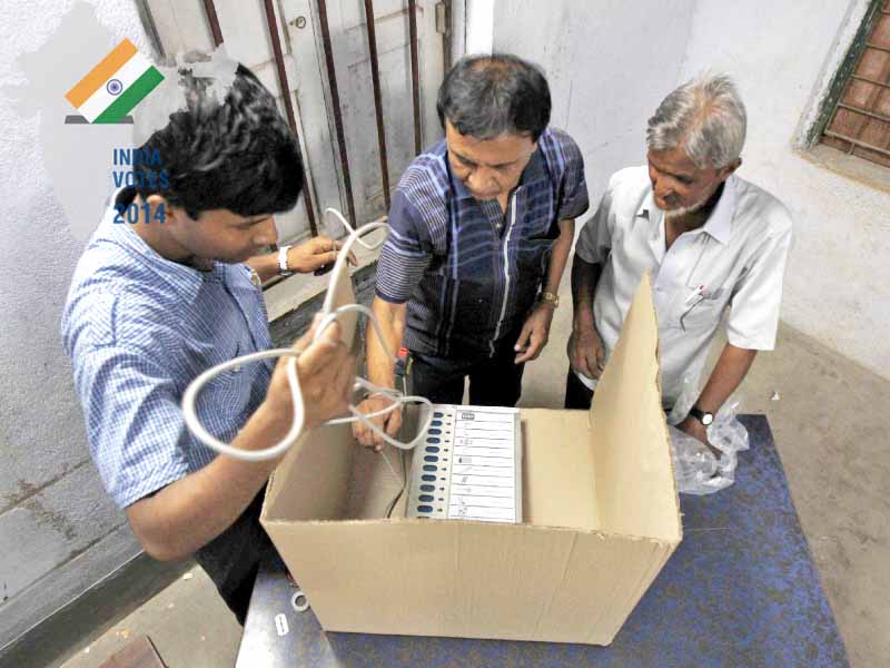members of election staff instal an electronic voting machine evm inside a polling station on the eve of the final phase of general election in kolkata may photo reuters