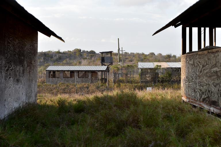 this photo made during an escorted visit and reviewed by the us military shows the razor wire topped fence and a watch tower at the abandoned quot camp x ray quot detention facility at the us naval station in guantanamo bay cuba on april 9 2014 photo afp