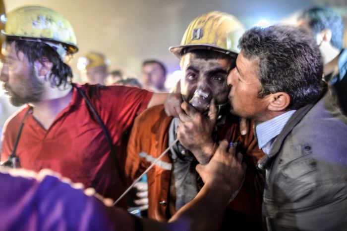 a miner celebrates with his father r after being rescued from the collapsed mine in the western turkish city of manisa photo afp