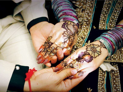 75 couples marry in mass wedding