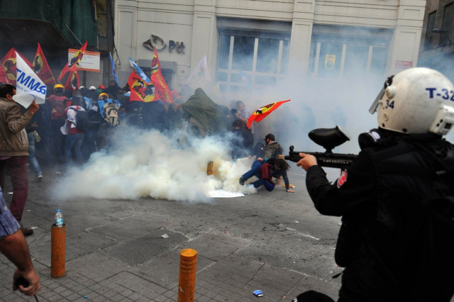 riot police disperse protestors with tear gas and rubber bullets during a protest at istiklal avenue in istanbul on may 14 2014 photo afp riot police disperse protestors with tear gas and rubber bullets during a protest at istiklal avenue in istanbul on may 14 2014 photo afp