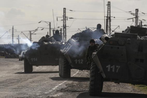 ukrainian armored personnel carriers are seen near the village of salkovo in kherson region adjacent to crimea march 18 2014 photo reuters