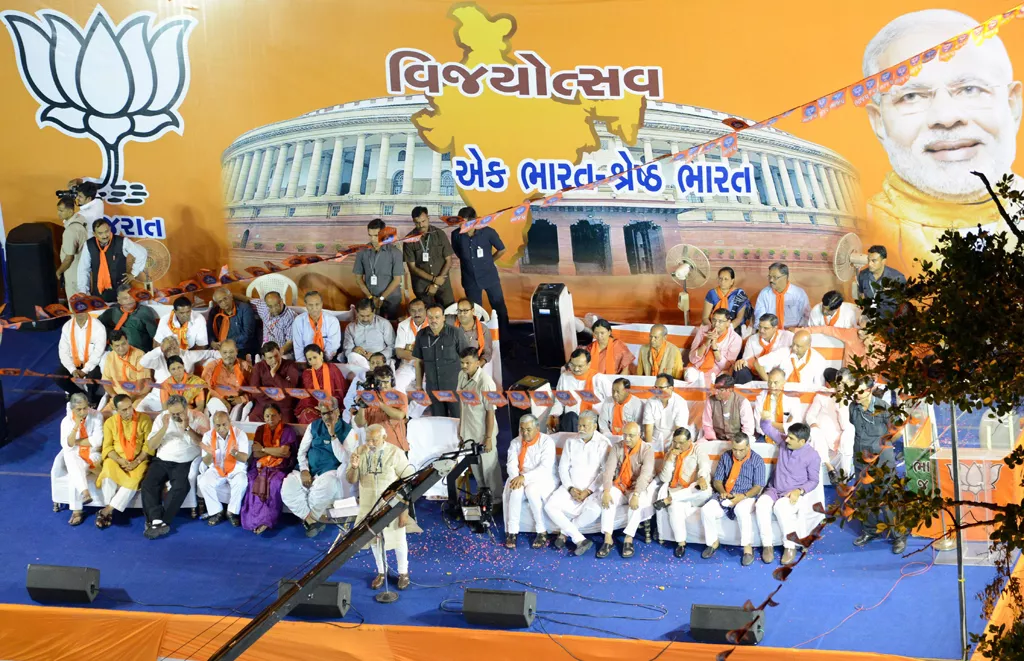 chief minister of western gujarat state and main opposition bharatiya janata party bjp prime ministerial candidate narendra modi c front addresses a rally in ahmedabad on may 16 2014 photo afp chief minister of western gujarat state and main opposition bharatiya janata party bjp prime ministerial candidate narendra modi c front addresses a rally in ahmedabad on may 16 2014 photo afp
