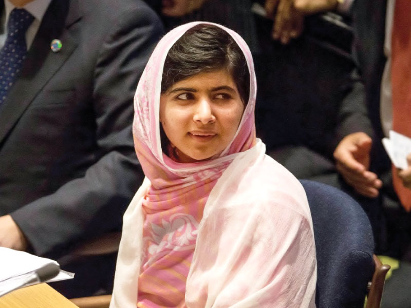 the poster showed series of images of malala being shot falling backwards covered in blood being put on a drip and then bouncing off a mattress and recovering to receive an award photo afp