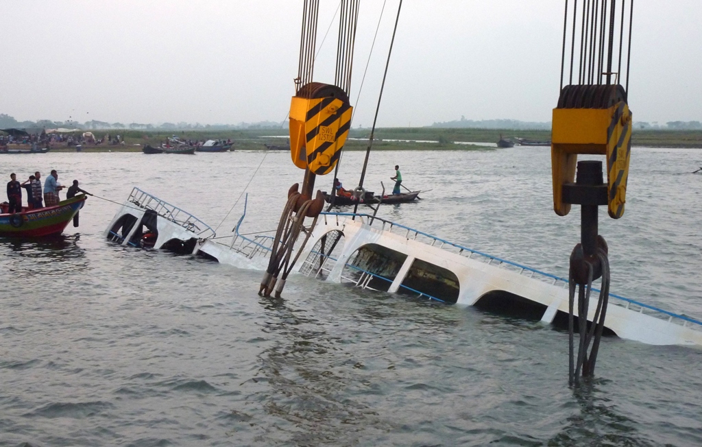 bangladeshi rescue workers search for dead bodies inside the sunken ferry on the river meghna in munshiganj district some 50 kilometres south of dhaka on may 17 2014 photo afp