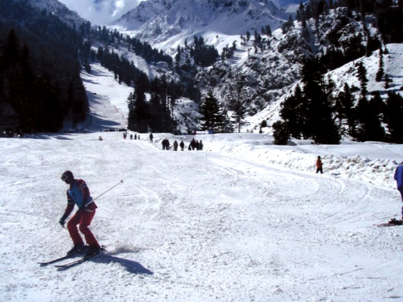 a man skies along a slope in naltar photo express