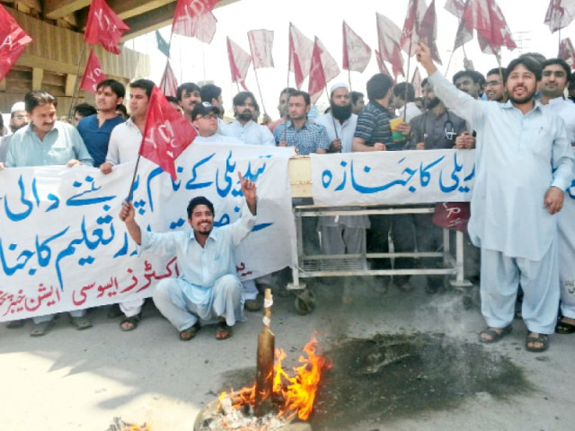yda members burn a tyre and chant slogans to get government s notice photo express yda members burn a tyre and chant slogans to get government s notice photo express