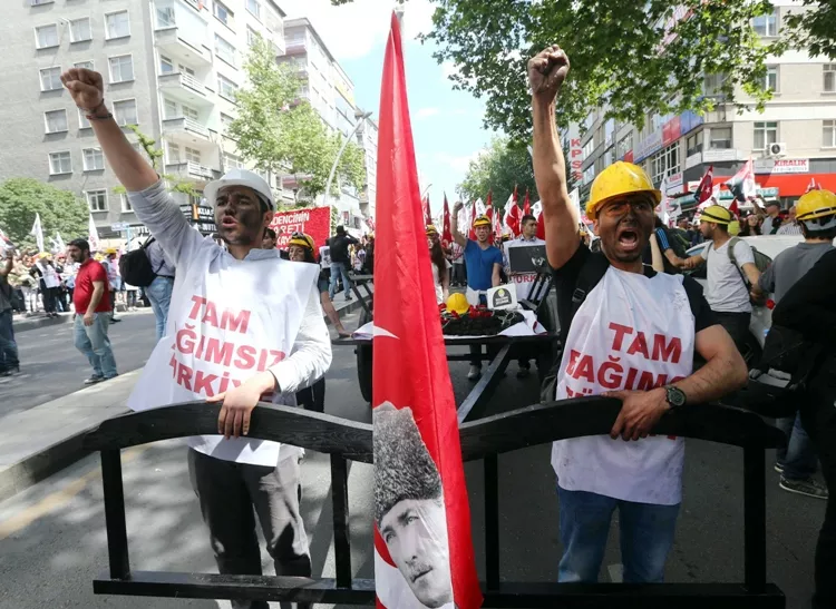 protesters wearing hard hats raise their fists as they march pulling a cart bearing a pile of coal roses a hard hat a turkish flag with the image of mustafa kemal ataturk the founder of modern turkey during a demonstration by the leftist turkish youth union to protest the 301 deaths of the soma coal mine accident and demand the turkish prime minister 039 s resignation in ankara on may 19 2014 photo afp protesters wearing hard hats raise their fists as they march pulling a cart bearing a pile of coal roses a hard hat a turkish flag with the image of mustafa kemal ataturk the founder of modern turkey during a demonstration by the leftist turkish youth union to protest the 301 deaths of the soma coal mine accident and demand the turkish prime minister 039 s resignation in ankara on may 19 2014 photo afp