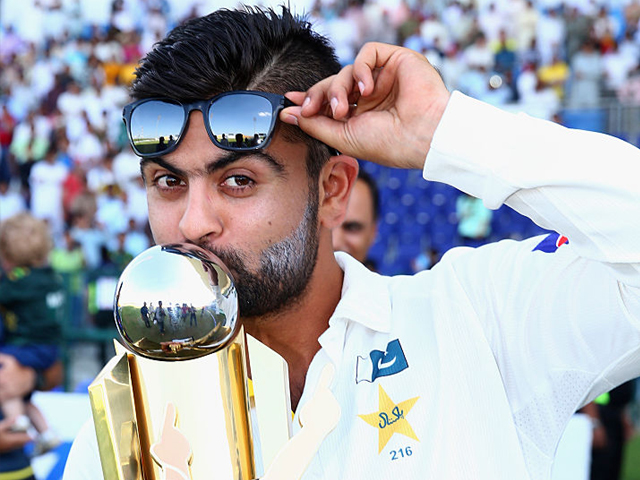 ahmed shehzad of pakistan celebrates with the trophy after pakistan won the series 2 0 during day five of the second test between pakistan and australia at sheikh zayed stadium on november 3 2014 in abu dhabi united arab emirates photo getty