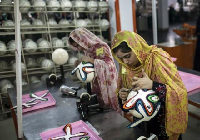 an employee adjusts outer panels on a soccer ball inside the soccer ball factory that produces official match balls for 2014 world cup in brazil in sialkot may 16 2014 photo reuters an employee adjusts outer panels on a soccer ball inside the soccer ball factory that produces official match balls for 2014 world cup in brazil in sialkot may 16 2014 photo reuters