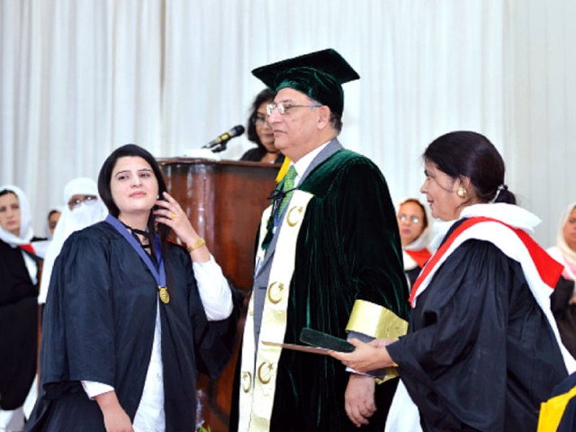 qau vice chancellor eatzaz ahmad awarding medals to high achievers photo express