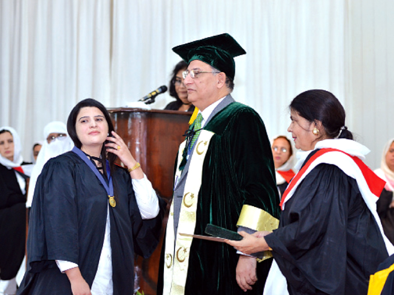 qau vice chancellor eatzaz ahmad awarding medals to high achievers photo express