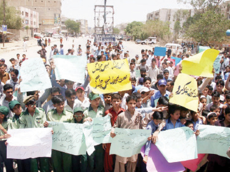 students and faculty members of schools in site and orangi town protested against extortionists on wednesday photo online