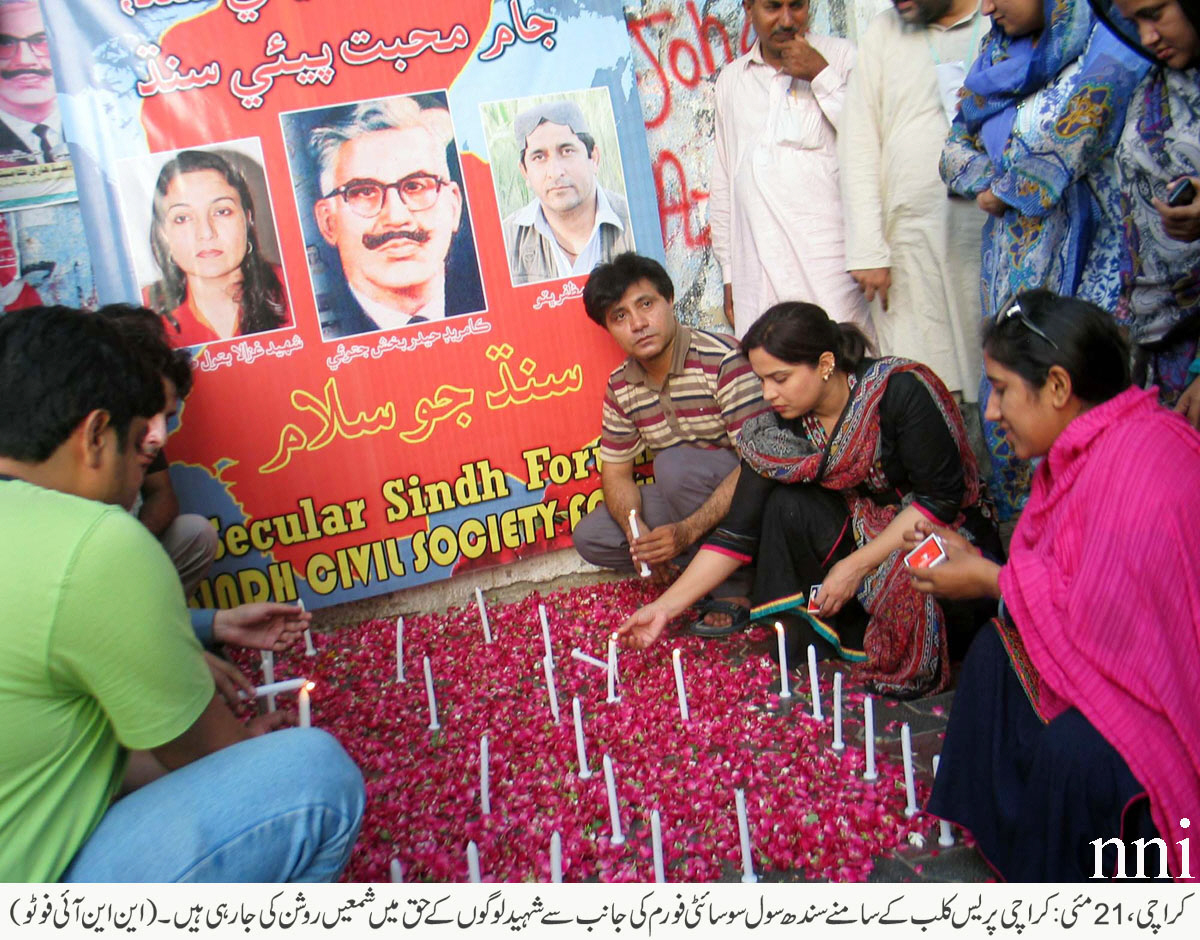 members of secular sindh forum and sindh civil society light candles to remember hyder bux jatoi outside the karachi press club on wednesday photo nni