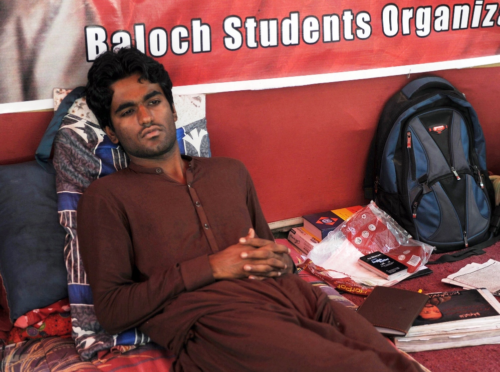 in this photograph taken on may 21 2014 bso activist lateef johar sits at a hunger strike camp during a protest in karachi photo afp