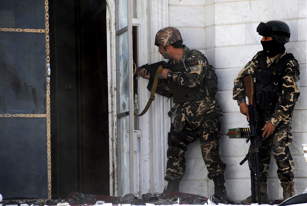 afghan military personal take position at the scene of an attack on the indian consulate in herat on may 23 2014 photo afp