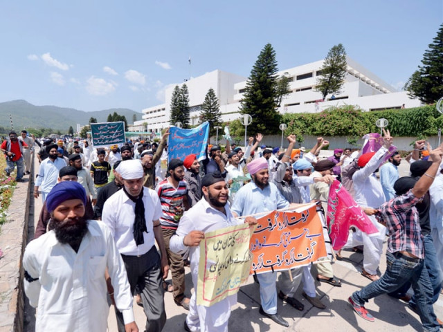 sikh protesters chant slogans as they protest outside the parliament house photo afp sikh protesters chant slogans as they protest outside the parliament house photo afp