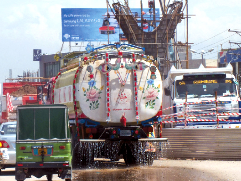 a water tanker being used to settle dust around murree road photo agha mehroz express