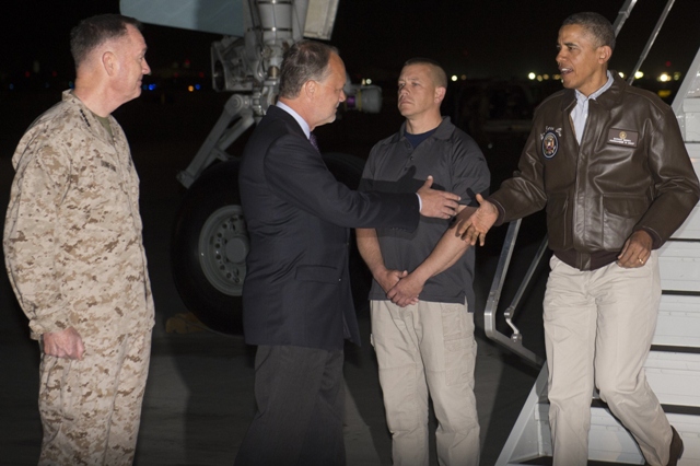 us president barack obama greets us ambassador to afghanistan james cunningham c and general joseph dunfore commander of isaf and us forces afghanistan after disembarking from air force one upon arrival at bagram air field north of kabul in afghanistan on a surprise trip to visit us troops prior to the memorial day holiday photo afp