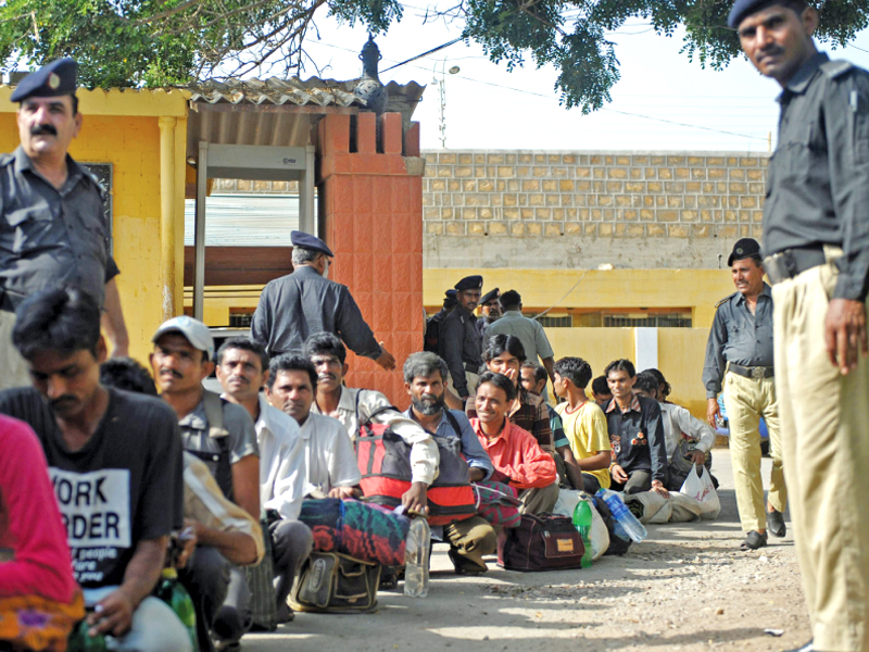 policemen prepare to release jailed indian fishermen from malir district jail karachi photo afp