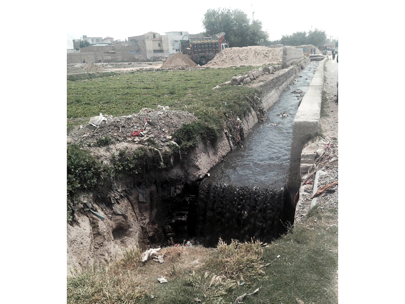 sewage flows adjacent to land on which vegetables are grown they are irrigated with this water photo banaras khan express