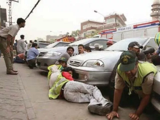 local residents and rescue workers take cover during an attack on an ahmadi worship centre in lahore s garhi shahu neighborhood on may 28 2010 photo file local residents and rescue workers take cover during an attack on an ahmadi worship centre in lahore s garhi shahu neighborhood on may 28 2010 photo file