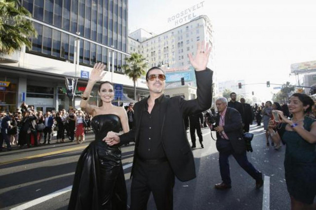 cast member angelina jolie and actor brad pitt wave at fans as they arrive at the premiere of 039 039 maleficent 039 039 at el capitan theatre in hollywood california may 28 2014 photo reuters cast member angelina jolie and actor brad pitt wave at fans as they arrive at the premiere of 039 039 maleficent 039 039 at el capitan theatre in hollywood california may 28 2014 photo reuters