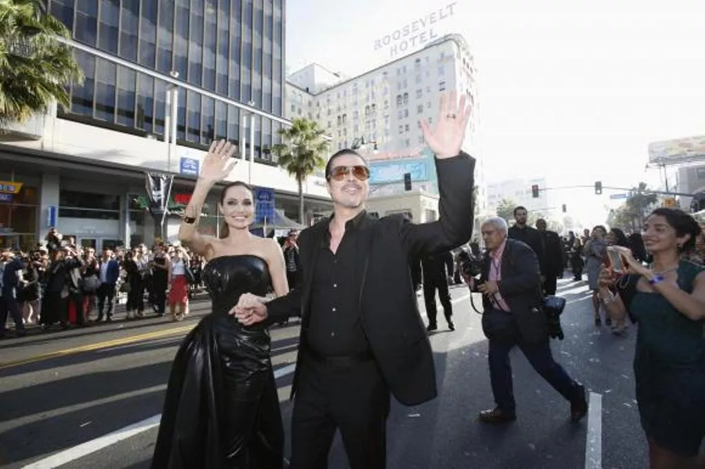 cast member angelina jolie and actor brad pitt wave at fans as they arrive at the premiere of 039 039 maleficent 039 039 at el capitan theatre in hollywood california may 28 2014 photo reuters cast member angelina jolie and actor brad pitt wave at fans as they arrive at the premiere of 039 039 maleficent 039 039 at el capitan theatre in hollywood california may 28 2014 photo reuters