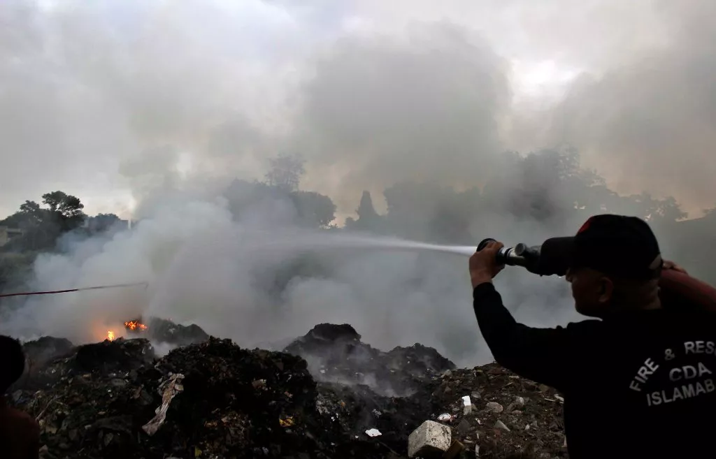 a fire fighter extinguishes the building on fire in islamabad photo muhammad javaid express a fire fighter extinguishes the building on fire in islamabad photo muhammad javaid express