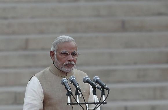 prime minister narendra modi takes his oath at the presidential palace in new delhi may 26 2014 photo reuters