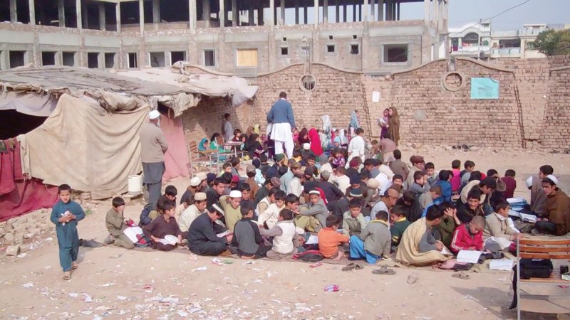 around 250 students have been receiving their basic education while sitting in the dirt under the open sky photo express