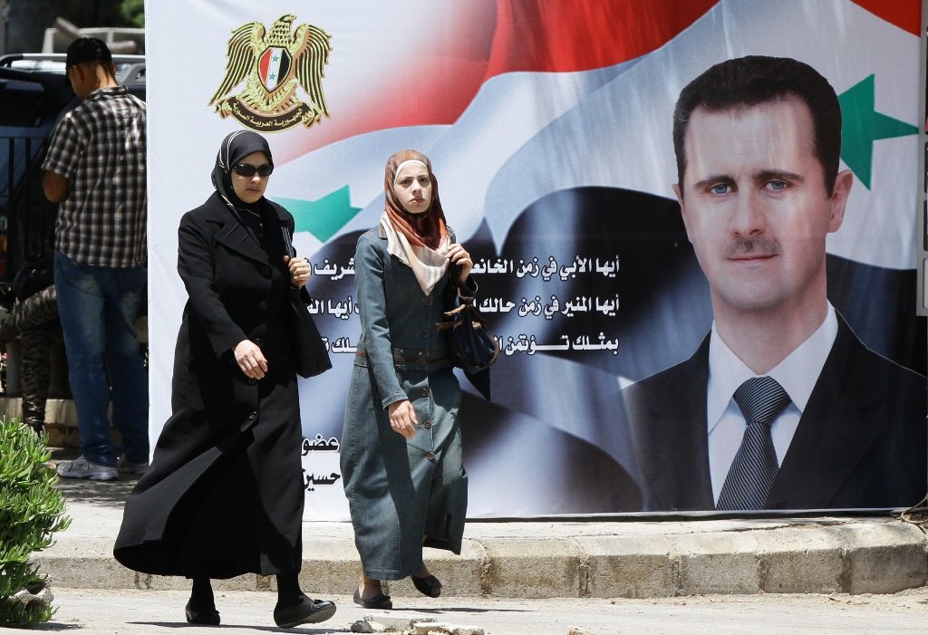 assad is running against two relatively unknown challengers approved by parliament to participate in election photo afp