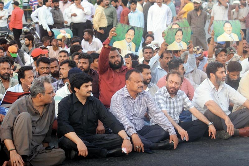 hundreds of mqm workers gathered at numaish chowrangi to show support for their chief altaf hussain who was arrested in london earlier that day photo athar khan express