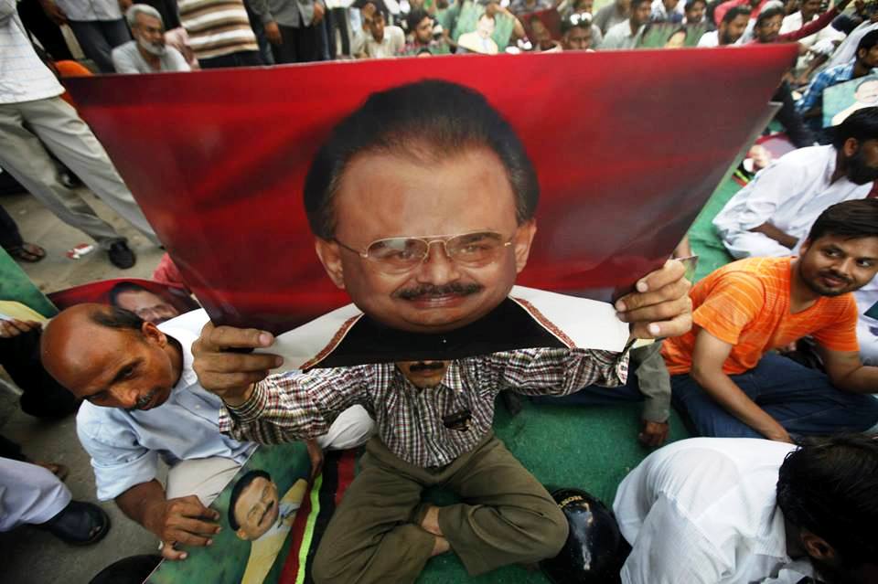 an mqm supporter holds photograph of altaf hussain during a gathering nine zero in karachi on june 3 2014 following the arrest of hussain in london photo reuters