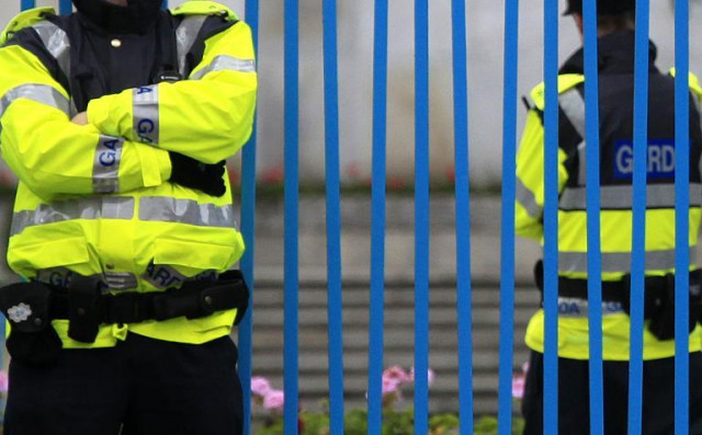 irish police stand guard outside a garden of remembrance in dublin on may 15 2011 photo afp irish police stand guard outside a garden of remembrance in dublin on may 15 2011 photo afp