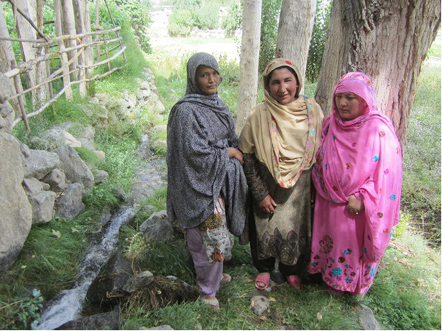 r to l sakina khanum and their friend pose for a photo next to a water channel in siksa valley gilgit baltistan photo rina saeed khan r to l sakina khanum and their friend pose for a photo next to a water channel in siksa valley gilgit baltistan photo rina saeed khan
