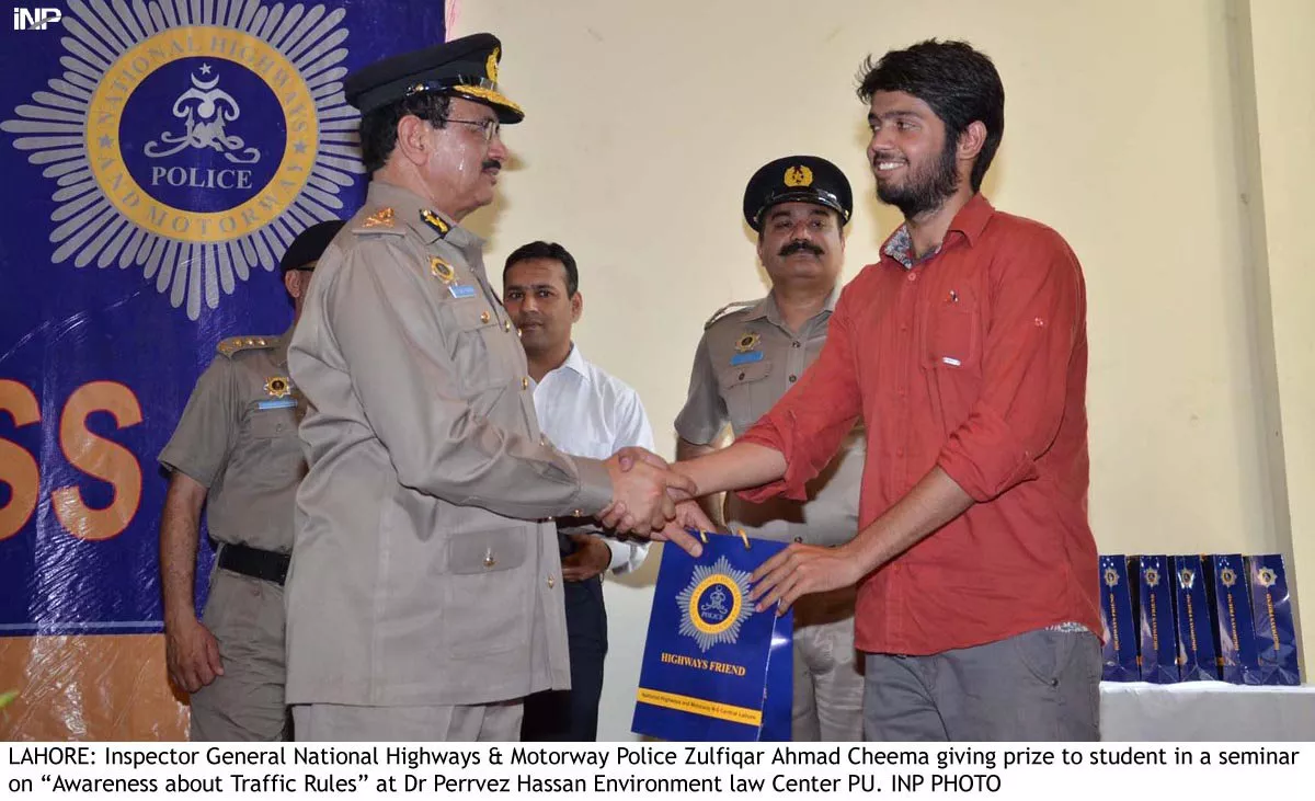 inspector general national highway police giving prize to student in a seminar photo inp inspector general national highway police giving prize to student in a seminar photo inp