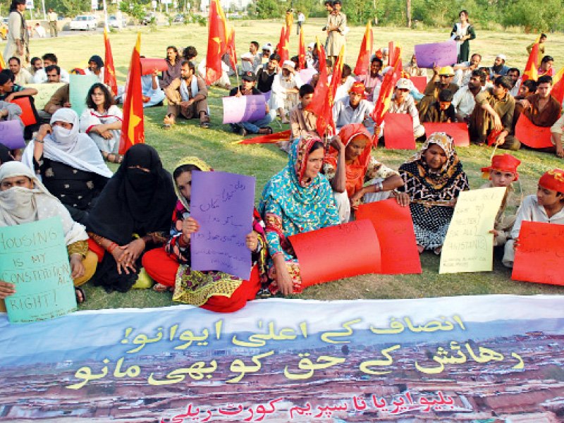 activists of all pakistan alliance for kachi abadis and awp stage a sit in in blue area islamabad on wednesday photo muhammad javaid express