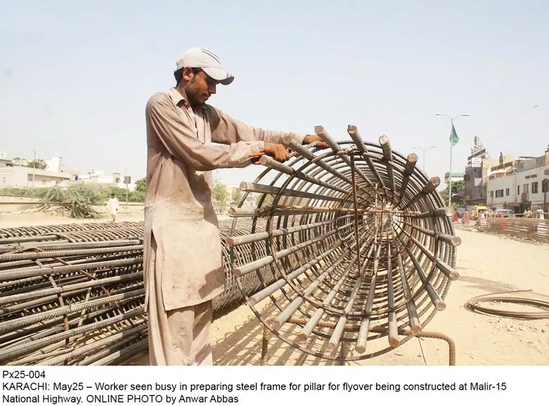 a labourer prepares the steel frame for a pillar of the flyover being constructed at malir 15 the construction has been delayed by five months and is expected to be completed by september this year photo file a labourer prepares the steel frame for a pillar of the flyover being constructed at malir 15 the construction has been delayed by five months and is expected to be completed by september this year photo file