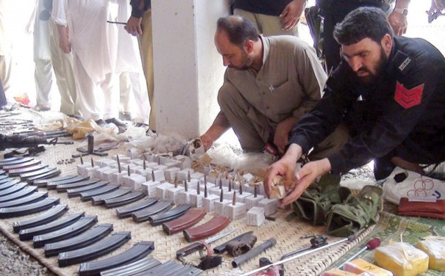 four grenades three three nought three rifles one foreign made assault rifle hundreds of rounds of bullets and three kilogrammes of hashish were found in the van photo inp