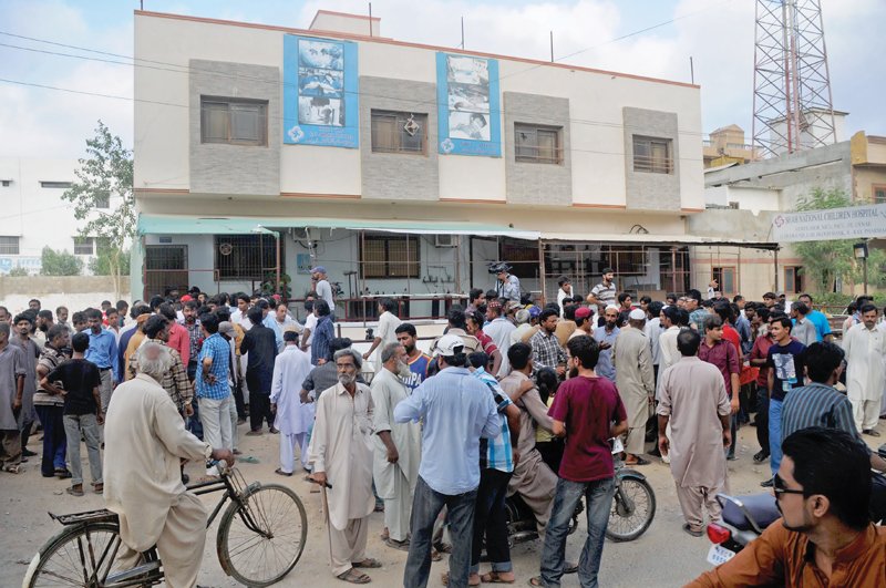 a large crowd gathers outside shah national children s hospital in korangi where four children who were on ventilators died allegedly because the hospital ran out of oxygen photo mohammad noman express