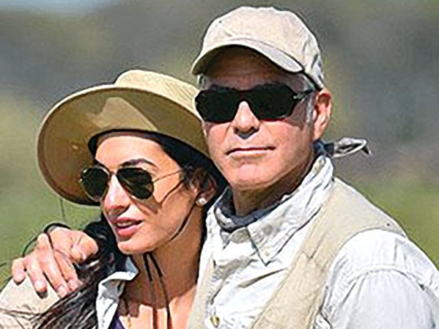 george clooney with his fianc e amal alamuddin photo file george clooney with his fianc e amal alamuddin photo file
