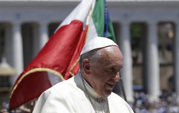 pope francis looks on as he rides past an italian flag during a special audience for carabinieri paramilitary police in saint peter 039 s square at the vatican june 6 2014 photo reuters