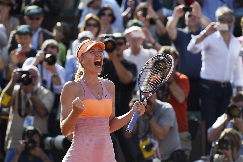russia 039 s maria sharapova celebrates as she wins the french tennis open final match against romania 039 s simona halep at the roland garros stadium in paris on june 7 2014 photo afp