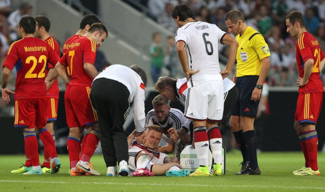germany 039 s midfielder marco reus c reacts injured on the pitch during the friendly football match germany vs armenia in preparation for the fifa world cup 2014 on june 6 2014 in mainz central germany photo afp germany 039 s midfielder marco reus c reacts injured on the pitch during the friendly football match germany vs armenia in preparation for the fifa world cup 2014 on june 6 2014 in mainz central germany photo afp