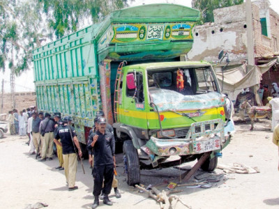 twin tragedies at least 12 dead as speeding trucks ram into vans in sindh