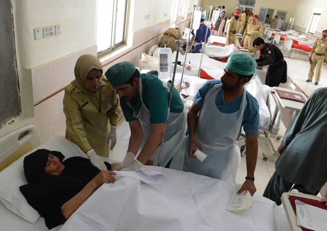 an injured pilgrim is treated at a hospital in quetta following an attack in taftan photo afp